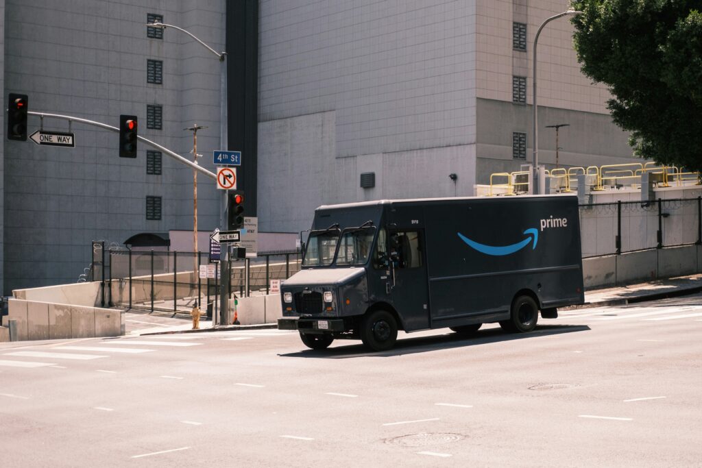 Amazon Prime delivery truck transporting orders to customers who buy professional cleaning supplies online from Daitona General Trading.